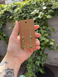 Green dangle suncatcher earrings